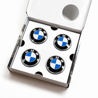 Set of four BMW 68mm floating wheel centre caps with blue and white emblems, black outer rings and chrome-effect edges in a presentation box