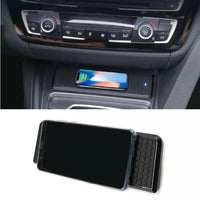 DHStyling black wireless phone charging pad with plug-and-play wiring for BMW 3 and 4 Series F-Series models from 2016 onwards