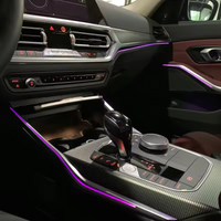 DHStyling BMW 3 Series G20 ambient lighting kit for 2019–2026 with three dashboard light trims, four door trims, two carbon-effect centre console trims, storage lights, handle lights, footwell lights, control modules and wiring.
