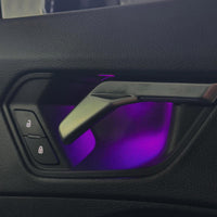 DHStyling Audi Q3 F3 2019–2024 RGB ambient lighting kit with dashboard LED strips, four illuminated door trims, footwell lights and wiring harnesses.

