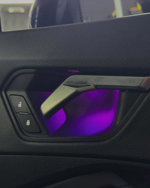 DHStyling Audi Q3 F3 2019–2024 RGB ambient lighting kit with dashboard LED strips, four illuminated door trims, footwell lights and wiring harnesses.
